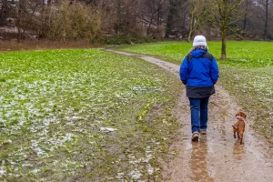 A person walking in rainy weather in Singapore.